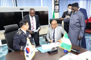 R-L: The Director General/CEO, Nigerian Maritime Administration and Safety Agency (NIMASA) Dr. Bashir Jamoh; Director, Legal Services NIMASA, Mr. Victor Egejuru Esq. and Director for International and Intelligence Bureau of the Korea Coast Guard (KCG) Seonggi Kang during the signing of a Memorandum of Understanding (MoU) of cooperation in the field of Maritime Security and Safety at the NIMASA Headquarters in Lagos