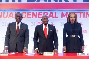 Founder and Chairman, Zenith Bank Plc, Mr. Jim Ovia, CON (Centre) flanked by the Group Managing Director/CEO, Mr. Ebenezer Onyeagwu (Left) and the Deputy Managing Director, Dame (Dr.) Adaora Umeoji (Right) at the 31st Annual General Meeting of the bank held at the Civic Centre, Victoria Island, Lagos