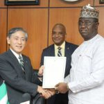 Honorable Minister of State Federal Ministry of Budget and National Planning, Prince Clem Agba (right) and Ambassador Extraordinary and plenipotentiary of Japan to Nigeria, His Excellency Kazuyoshi Matsunaga (left) holding the signed Exchange of Note (E/N) document while the Director General, Nigerian Maritime Administration and Safety Agency (NIMASA), Dr. Bashir Jamoh (middle) looks on during the signing of the Exchange of Note (E/N) with the Japanese Government for the Economic and Social Development Programme in Abuja.