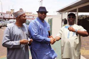 Executive Director, Maritime Labour and Cabotage Services, Nigerian Maritime Administration and Safety Agency (NIMASA), Engr. Victor Ochei (middle) presenting a Biometric Identity Card to the President General, Maritime Workers’ Union (MWUN), Comrade Adewale Adeyanju (right) while the Head, Maritime Labour Services NIMASA, Aliyu Lawan looks on during the Official Flag-Off Ceremony of Maritime Labour e-Registration Platform and Issuance of Biometric Identity Cards to Dockworkers in Lagos