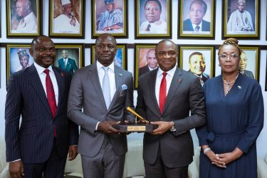 UBA New Executives at NGX 2: l-r: Deputy Managing Director, United Bank for Africa(UBA) Plc, Mr. Muyiwa Akinyemi; Chief Executive Officer, Nigerian Exchange (NGX) Ltd , Mr. Temi Popoola and Group Managing Director/CEO, United Bank for Africa(UBA) Plc, Mr Oliver Alawuba; and Director, Nigerian Exchange (NGX) Ltd , Erelu Angela Adebayo, during the ceremonial strike of the closing gong at the floor of the Exchange by Alawuba in honour of recently appointed UBA’s executive management, on Wednesday in Lagos